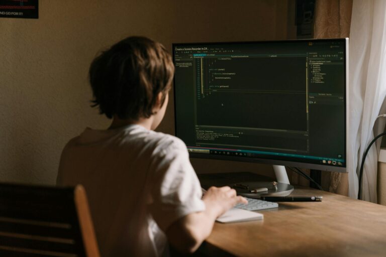 Boy working on an Antivirus protected desktop computer